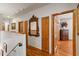 Upper hallway with hardwood floors and access to bedrooms at 5800 N Dean Rd, Orlando, FL 32817