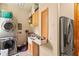 Bright laundry room with washer, dryer, and extra storage at 5800 N Dean Rd, Orlando, FL 32817