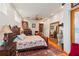 Main bedroom with floral bedding and large mirror at 5800 N Dean Rd, Orlando, FL 32817