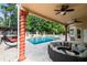 Inviting pool area with a covered patio and lounge seating at 5800 N Dean Rd, Orlando, FL 32817