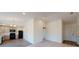 Open living room with kitchen view and hardwood floors at 590 E Division W St, Deland, FL 32724