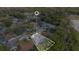 Aerial view featuring a neighborhood surrounded by lush trees and a beautiful cul-de-sac street at 605 Marni Dr, Winter Springs, FL 32708