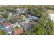 Aerial shot showcasing the residential neighborhood surrounded by lush greenery and winding roads at 605 Marni Dr, Winter Springs, FL 32708