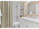 Bathroom featuring a tiled shower, modern vanity, and decorative framed art at 605 Marni Dr, Winter Springs, FL 32708