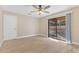 Bedroom featuring sliding glass door, ceiling fan and new tile flooring at 605 Marni Dr, Winter Springs, FL 32708