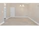 Dining area featuring new tile floors, neutral paint, modern light fixture, and entry to kitchen at 605 Marni Dr, Winter Springs, FL 32708