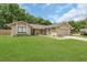 Inviting home featuring a two-car garage, well-kept lawn, and charming curb appeal at 605 Marni Dr, Winter Springs, FL 32708