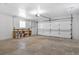 Attached garage with ample storage, pegboard, shelving, and a bright, functional space at 605 Marni Dr, Winter Springs, FL 32708