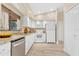 Well-lit kitchen featuring stainless steel dishwasher and granite countertops at 605 Marni Dr, Winter Springs, FL 32708