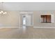 Bright and airy living room showcasing new wood-look tile, neutral paint and decorative light fixture at 605 Marni Dr, Winter Springs, FL 32708