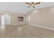 Well-lit living area featuring new floors, a modern ceiling fan, and lots of natural light at 605 Marni Dr, Winter Springs, FL 32708
