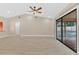 Spacious living room with high ceilings, new flooring, ceiling fan and large sliding glass doors to backyard at 605 Marni Dr, Winter Springs, FL 32708
