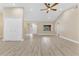 Open floor plan living room with vaulted ceiling, wood-look tile floor and lots of light at 605 Marni Dr, Winter Springs, FL 32708