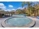 Community pool area featuring a jacuzzi, lounge chairs and swimming pool at 605 Marni Dr, Winter Springs, FL 32708