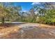 Outdoor recreation area with a basketball court and sand volleyball court surrounded by nature at 605 Marni Dr, Winter Springs, FL 32708