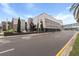 Street view of a commercial building showing its façade, street access, and some off street parking at 62 W Colonial Dr # 302, Orlando, FL 32801