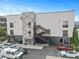 Close exterior view of a commercial building, highlighting its architecture, entrance, and parking area at 62 W Colonial Dr # 302, Orlando, FL 32801