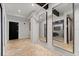 Hallway with modern accents and ample natural lighting showcases the property's interior design at 62 W Colonial Dr # 302, Orlando, FL 32801