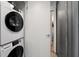 Modern, stacked washer and dryer in a space-saving laundry area at 62 W Colonial Dr # 302, Orlando, FL 32801