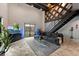 Modern living area with a comfortable sectional sofa, rug and an exposed wood beam at 62 W Colonial Dr # 302, Orlando, FL 32801
