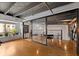 Bright and airy loft features hardwood floors, modern decor, and natural light from nearby windows at 62 W Colonial Dr # 302, Orlando, FL 32801
