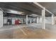 Spacious parking garage with ample parking spaces and secure storage lockers at 62 W Colonial Dr # 302, Orlando, FL 32801