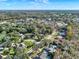 An aerial view of a residential area highlighting the tree-lined streets and well-maintained properties at 694 Benitawood Ct, Winter Springs, FL 32708