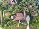 Aerial view of the property featuring the layout of the house and the landscaping around it at 694 Benitawood Ct, Winter Springs, FL 32708