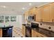 Modern kitchen with stainless steel appliances and granite countertops at 694 Benitawood Ct, Winter Springs, FL 32708