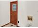 Laundry area features a wooden door with window, and an access panel at 694 Benitawood Ct, Winter Springs, FL 32708