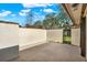 Enclosed patio with white walls, brick accents, and access to a grassy yard at 694 Benitawood Ct, Winter Springs, FL 32708