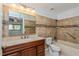 Bathroom with marble countertop, stylish tile accents, and a bathtub with safety bar at 725 Northlake Blvd # 95, Altamonte Springs, FL 32701