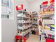 Well-organized pantry with ample shelving for food storage at 7409 Inlet Pt, Kissimmee, FL 34747