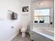 Clean bathroom with a toilet, bathtub, and modern fixtures at 8130 Yellow Crane Dr, Kissimmee, FL 34747