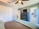 This bedroom features a ceiling fan, closet, chest of drawers, and bathroom access at 8130 Yellow Crane Dr, Kissimmee, FL 34747