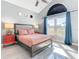 Main bedroom with statement windows, high ceilings, and stylish accents at 8130 Yellow Crane Dr, Kissimmee, FL 34747