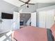 Well-lit main bedroom with a view into the hallway and closet space at 8130 Yellow Crane Dr, Kissimmee, FL 34747