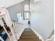 A foyer viewed from the top of the stairs with a bright, open floor plan at 8130 Yellow Crane Dr, Kissimmee, FL 34747