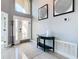 Elegant entryway featuring a modern door, sleek console table, and stylish decor at 8130 Yellow Crane Dr, Kissimmee, FL 34747