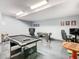 Spacious game room featuring a pool table, foosball table, and gaming setup at 8130 Yellow Crane Dr, Kissimmee, FL 34747
