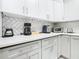 Well-equipped kitchen featuring modern appliances and sleek countertop design at 8130 Yellow Crane Dr, Kissimmee, FL 34747