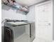 Functional laundry room with modern washer and dryer units at 8130 Yellow Crane Dr, Kissimmee, FL 34747
