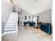 Bright and open living space featuring high ceilings, tile flooring, and comfortable seating at 8130 Yellow Crane Dr, Kissimmee, FL 34747