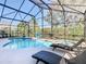 This is an outdoor pool area with a jacuzzi and lounge chairs at 8130 Yellow Crane Dr, Kissimmee, FL 34747