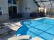 An enclosed pool area with a tanning ledge and a -safe fence around the pool at 8130 Yellow Crane Dr, Kissimmee, FL 34747