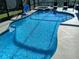 This in-ground pool has a jacuzzi and a basketball hoop at 8130 Yellow Crane Dr, Kissimmee, FL 34747
