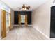 Bright living room featuring stylish wood flooring, a ceiling fan, and natural light from large windows at 933 Southern Oak Ln, Apopka, FL 32712