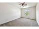 Bedroom with a carpet, ceiling fan, and a window at 11434 Wishing Well Ln, Clermont, FL 34711