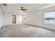 Large bedroom featuring windows with scenic views of the water at 11434 Wishing Well Ln, Clermont, FL 34711