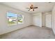 Bedroom with two large windows and a double-door closet at 11434 Wishing Well Ln, Clermont, FL 34711